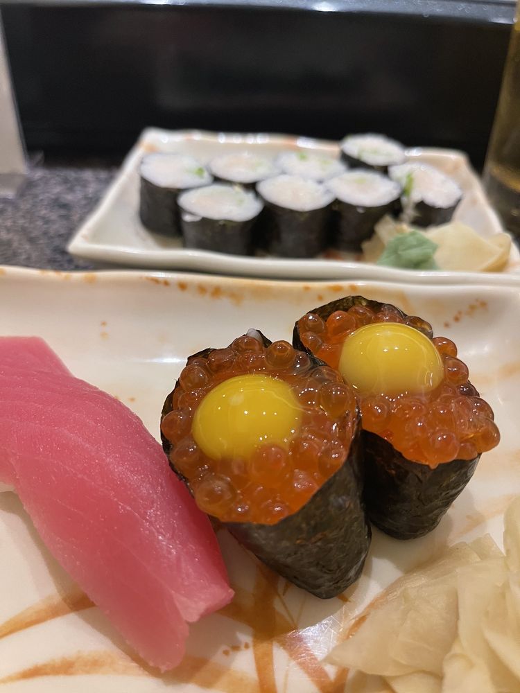Ikura and tuna nigiri at the sushi bar
